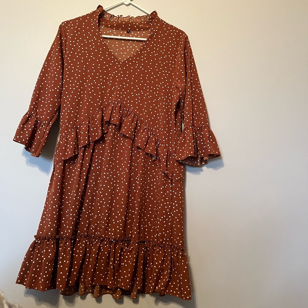 Rust polka dot dress. A line with small ruffles.